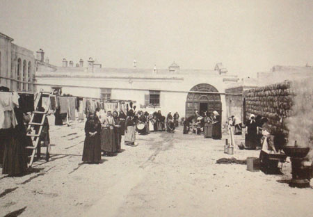 Washing of the clothes in a courtyard of the Mariinsky town church